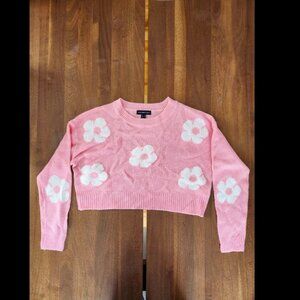 Pink cropped sweater with white floral design